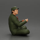 Jamie Farr sitting while eating breakfast in the MASH series - Only-Games