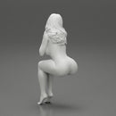 Sexy girl in swimsuit sitting - Only-Games