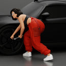 Girl mechanic in overalls turns off the front wheel of  car with a key for removing the wheel - Only-Games