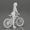 Young sexy sporty woman in pants and snickers short haired posing with bicycle - Only-Games