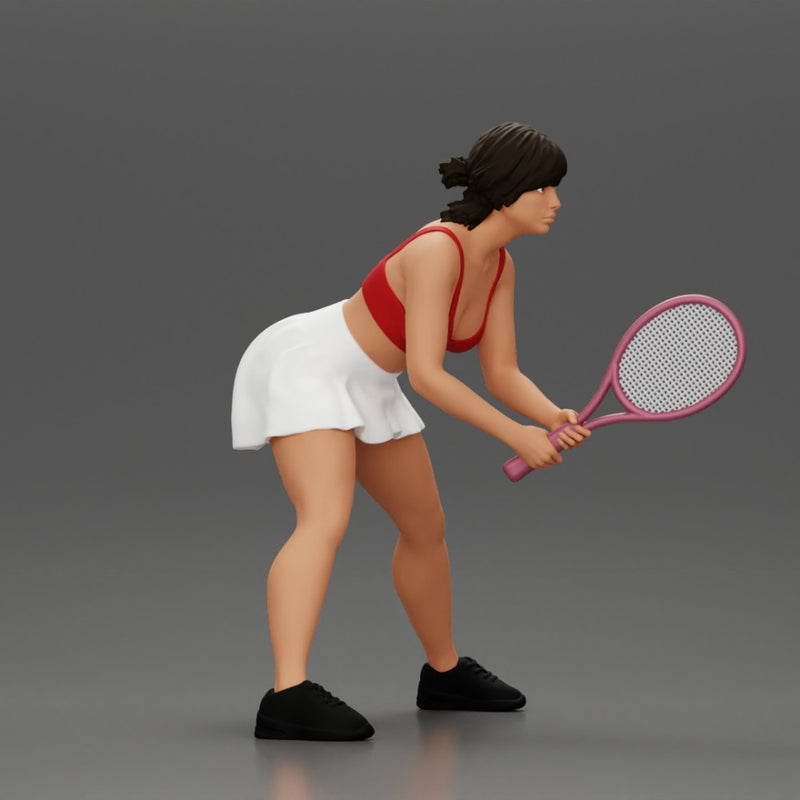 sexy tennis player in skirt holding her racket in a ready position