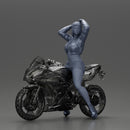 attractive girl on the motorbike stopping and putting hands on hair - Only-Games