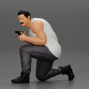 Gangster in pants sitting and holding a gun hides behind the car - Only-Games