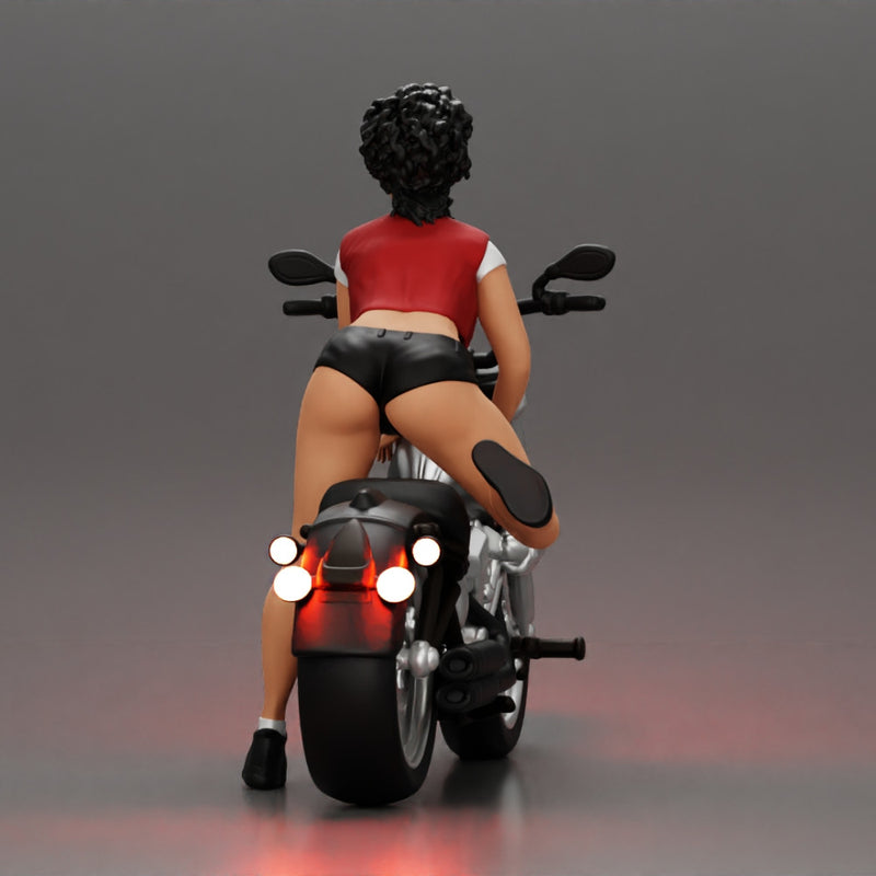 attractive girl on the motorbike in shorts and a mini jacket with curly hair