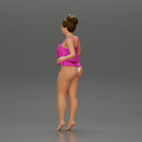 Sexy girl in bikini standing with her friend on the beach - Only-Games