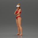 Sexy girl in a bikini and an empty top cap, thinking on the beach - Only-Games