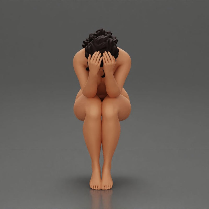 naked sad girl sitting and crying with her hands covering her face