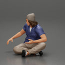 young man in a bonnet sitting crossing his legs and hugging a dog - Only-Games