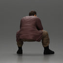 Thoughtful Man Squatting in Casual Outfit, Deep in Contemplation - Only-Games