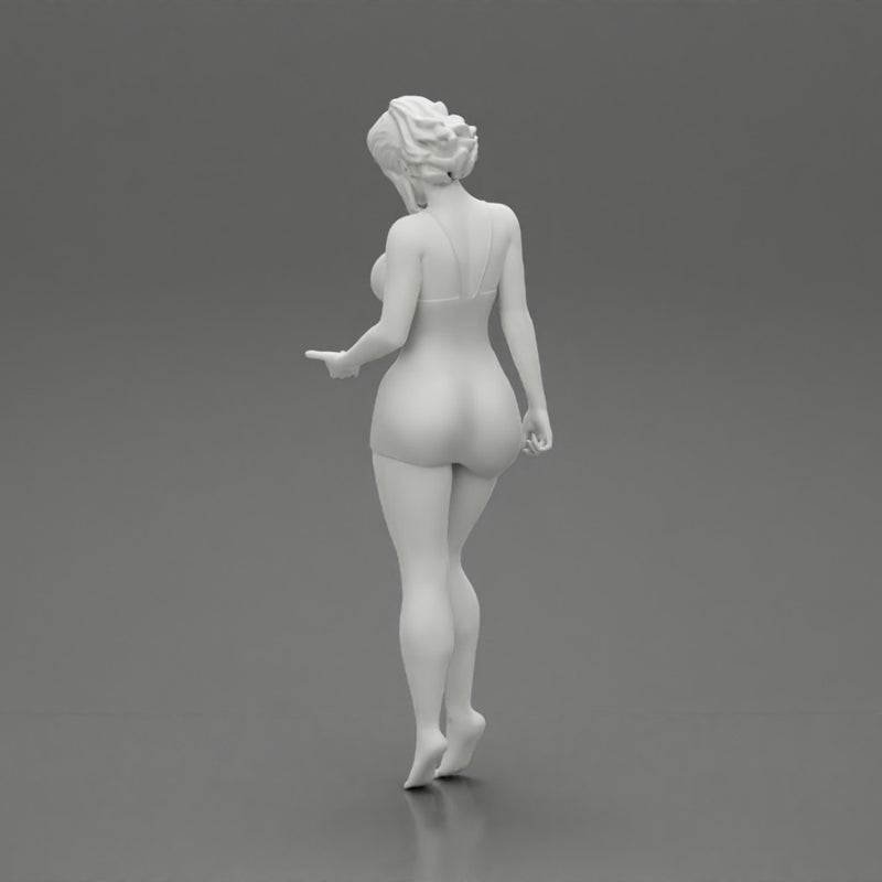 Sexy Girl standing in mini dress on the beach - Only-Games