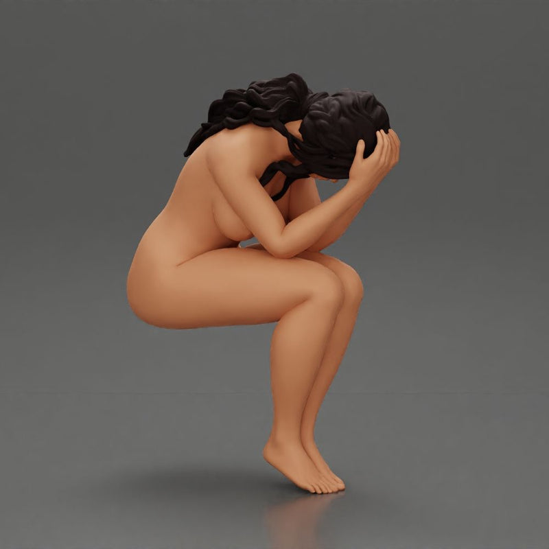 naked sad girl sitting and crying with her hands covering her face