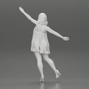 Happy Young Woman in dress and heels Standing on One Leg holding phone - Only-Games