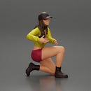 Young woman in a cap and mini jacket sitting and hugging her happy dog - Only-Games