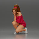 fashionable girl in beachwear is sitting and looking - Only-Games