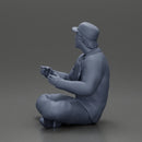 Jamie Farr sitting while eating breakfast in the MASH series - Only-Games