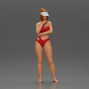 Sexy girl in a bikini and an empty top cap, thinking on the beach - Only-Games