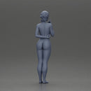 Naked woman standing hand resting on her back speaking into a radio - Only-Games