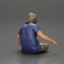 young man in a bonnet sitting crossing his legs and hugging a dog - Only-Games