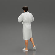 man in bathrobe standing - Only-Games