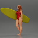 Attractive Young Woman Walking on Beach Holding Surfboard 2 - Only-Games
