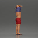 muscular man in shorts taking off his shirt to go swimming - Only-Games