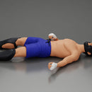 Defeated fighter lying on the floor after the battle - Only-Games