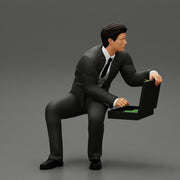 businessman sitting and holding briefcase of money - Only-Games