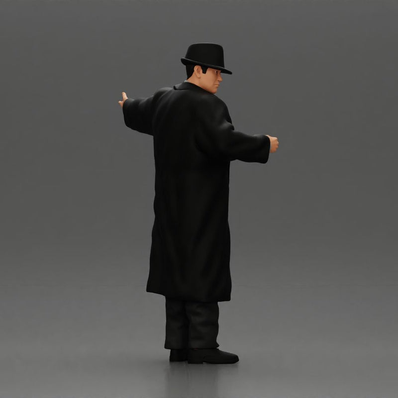 mafia man in gangster costume stands confidently while gesturing with his hands as if presenting something