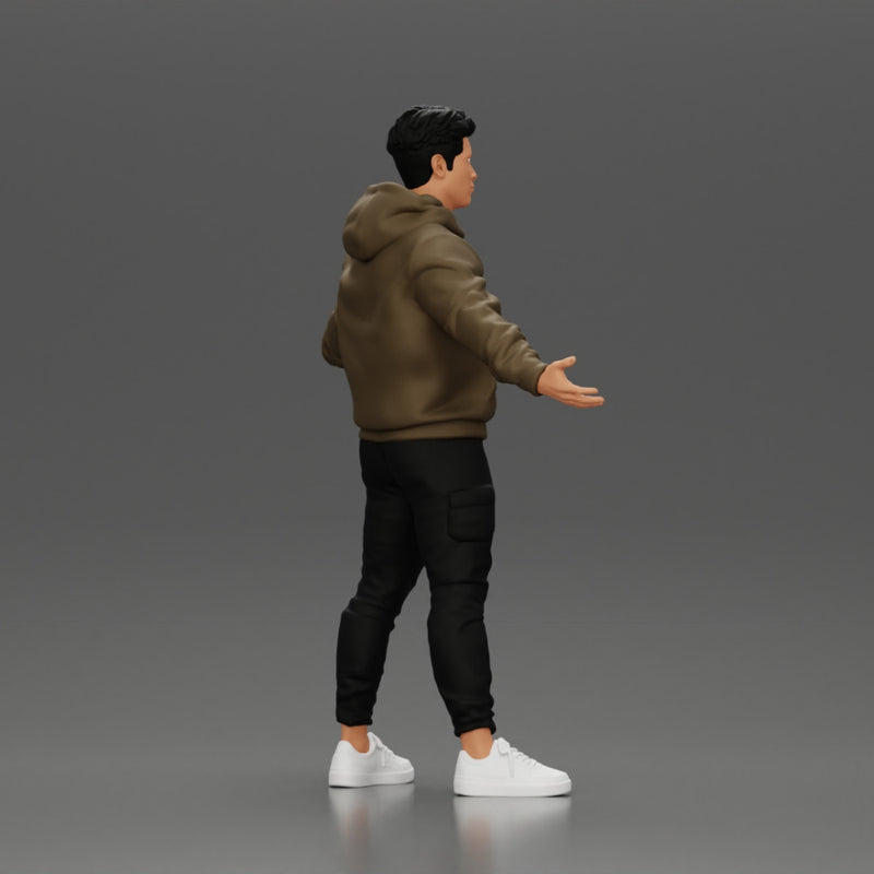 Asian Man Standing in Hoodie with Raised Hands