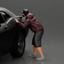 gangster man in a hoodie and cap shooting a gun behind the car - Only-Games