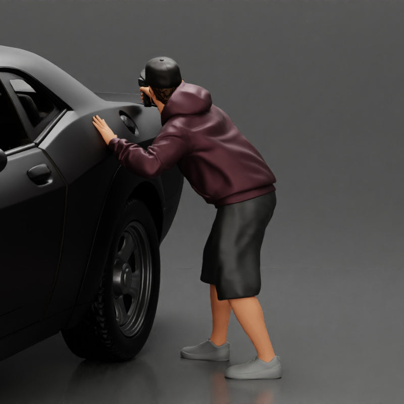 gangster man in a hoodie and cap shooting a gun behind the car