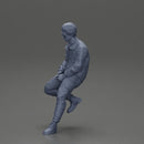 man sitting on a car, wearing a jacket and sunglasses, deep in thought - Only-Games