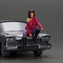 lowrider girl sitting on a car, wearing boots and a stylish shirt - Only-Games