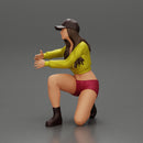 Young woman in a cap and mini jacket sitting and hugging her happy dog - Only-Games