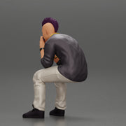 metal man sitting and contemplating with a satanic haircut - Only-Games