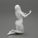 Sexy girl in lingerie bikini with long hair sitting on her knees - Only-Games