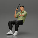 Gangster sitting at the table with a glass of whisky holding gun and playing poker - Only-Games