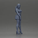 Confident Woman in Blue Dress Posing with Graceful Elegance - Only-Games