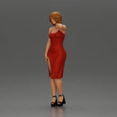 beautiful girl in a mini dress and heels with short hair places her hand on her neck - Only-Games