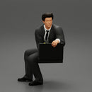 businessman sitting and holding briefcase of money - Only-Games