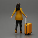 Business woman in manteau dragging suitcase  walking in airport terminal - Only-Games