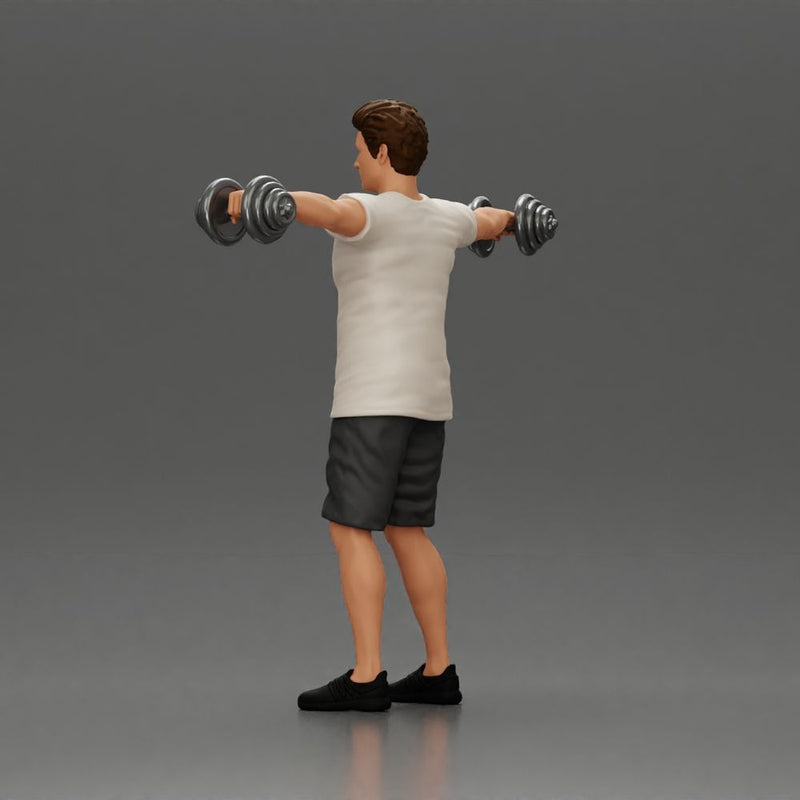 Man in the gym performing shoulder exercises with weights