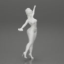 Happy Young Woman in pants Standing on One Leg holding phone - Only-Games