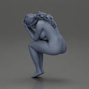 naked sad girl sitting and crying with her hands covering her face - Only-Games