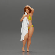 Sexy girl in bikini standing and covering her body by towel - Only-Games