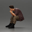 Thoughtful Man Squatting in Casual Outfit, Deep in Contemplation - Only-Games