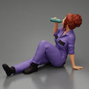 Tired woman mechanic sitting and drinking water during from bottle - Only-Games