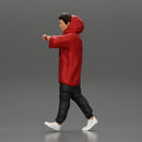 Man in a long hoodie  walking and looking at his watch - Only-Games