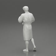man in bathrobe standing - Only-Games