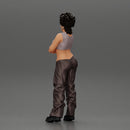 A chola girl with curly hair standing in large pants with crossed hands - Only-Games